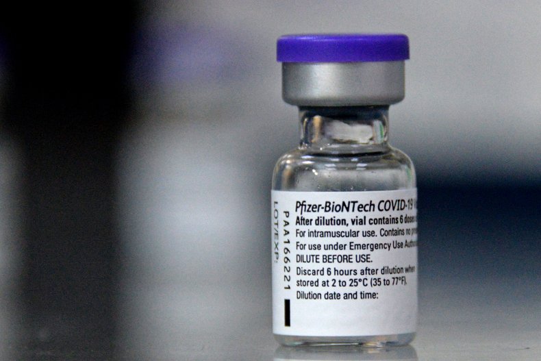 A vial containing a Pfizer vaccine dose.