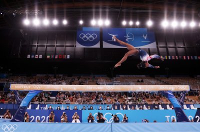 China Gymnasts Clinch Gold, Silver With Biles China Gymnasts Clinch Gold, Silver With Biles