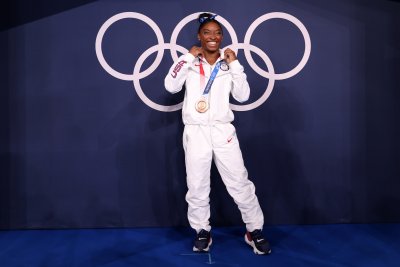 China Gymnasts Clinch Gold, Silver With Biles China Gymnasts Clinch Gold, Silver With Biles