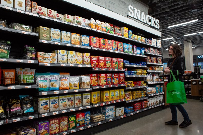 A shopper browses in the snack aisle