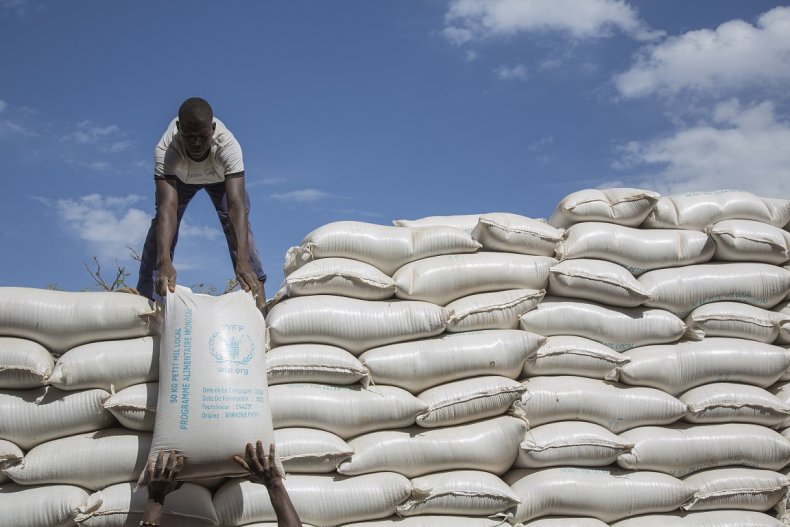 Workers offloading flour