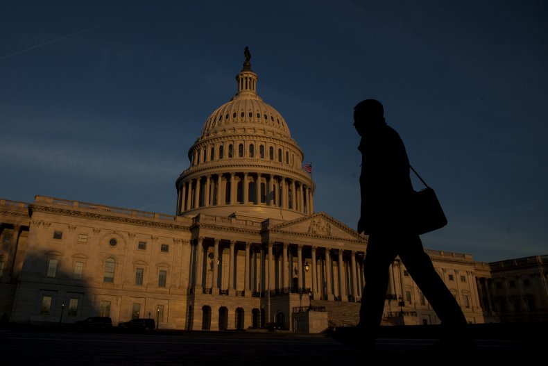Person walks past Capitol Building