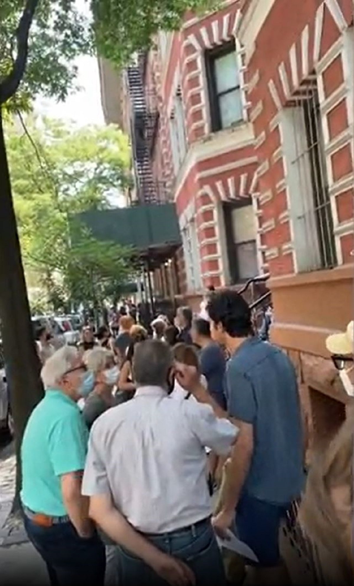 Photo of queue to view NYC apartment.