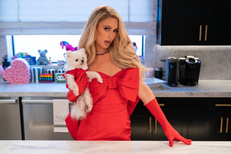Paris Hilton poses with her dog