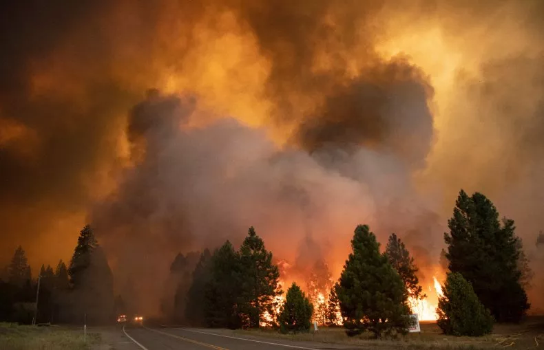 Flames from the dixie fire rip through Greenville, California.