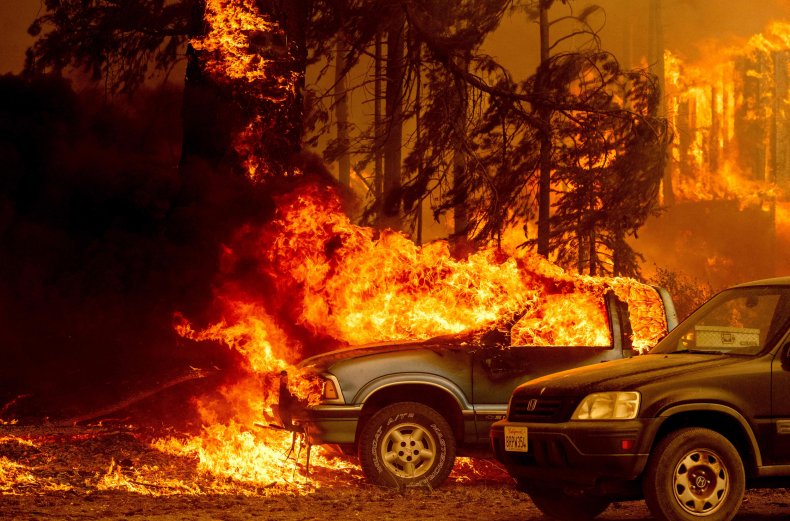 Vehicles and a home engulfed in fire