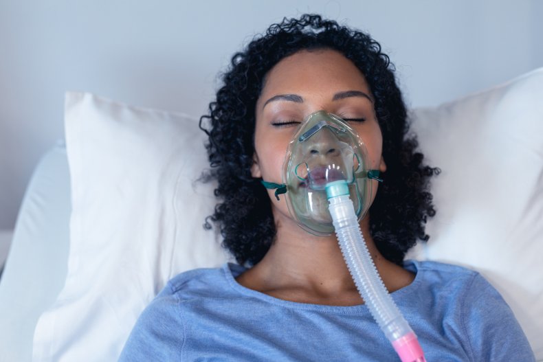 A patient using an oxygen ventilator.