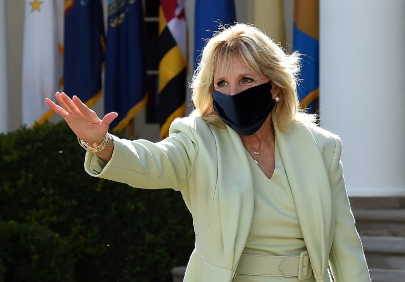 Jill Biden waves in the Rose Garden.