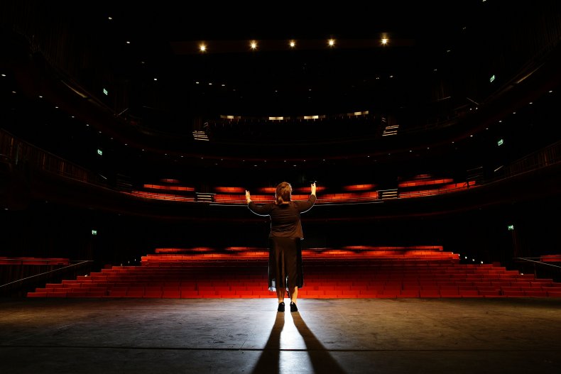 Woman singing in theater