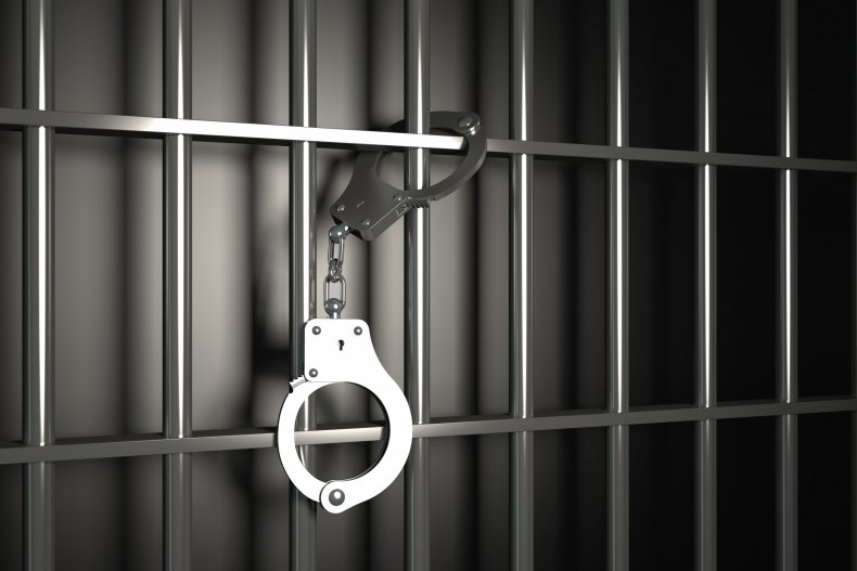 Prison bars and handcuffs