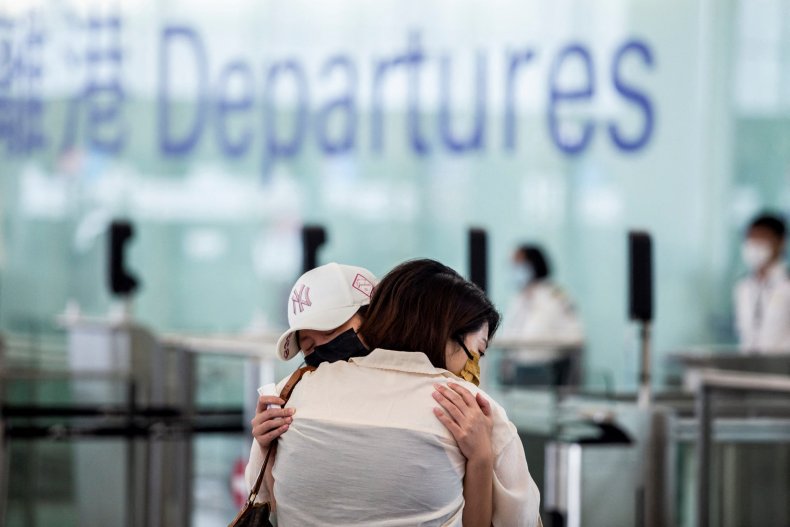 Hong Kongers hug at airport before departure