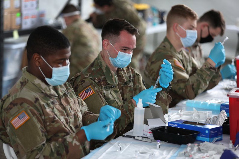 soldiers assisting with vaccines