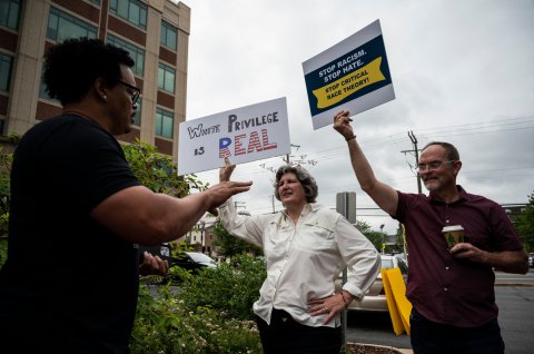 critical race theory protesters debate