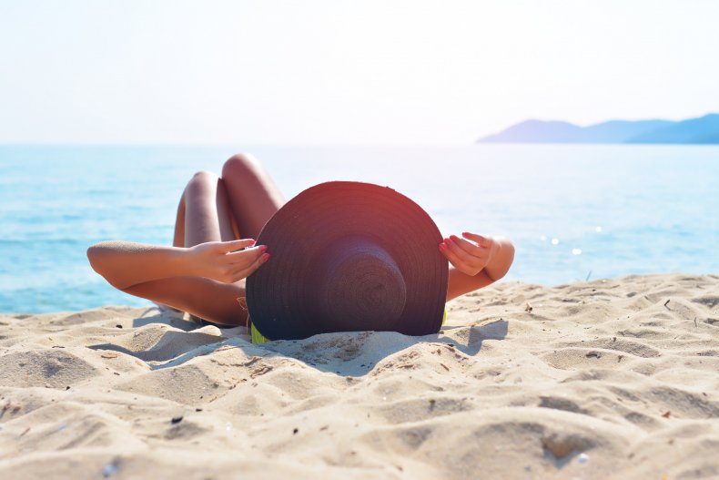 Woman sunbathing on a beach