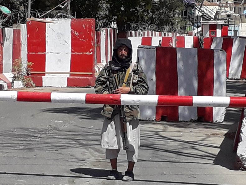 A Taliban fighter stands guard.