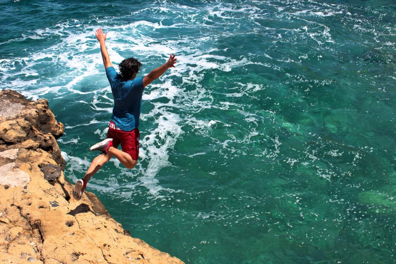 File photo of man cliff jumping. 