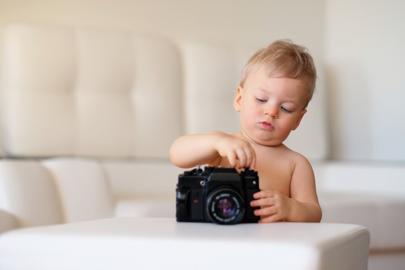 A child operating a camera