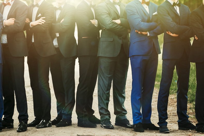 Men lined up in suits