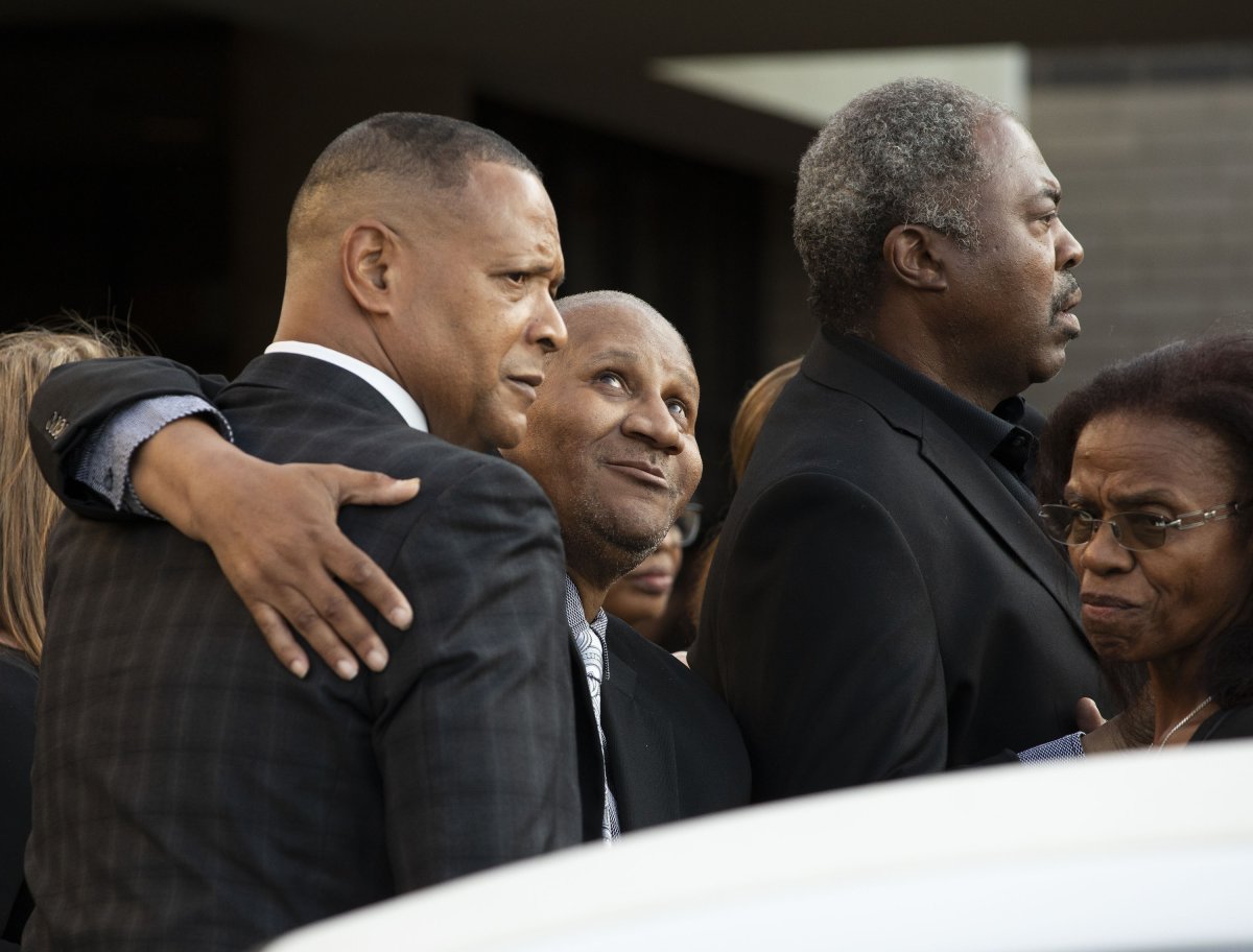 Mourners support Clarence Franklin (center) 