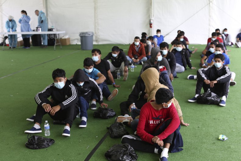 Migrants wait for COVID test