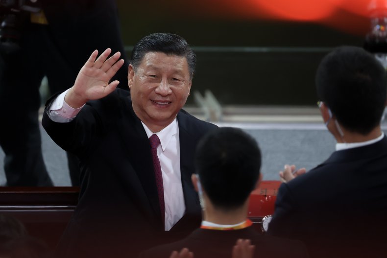  Chinese President Xi Jinping waves as he 