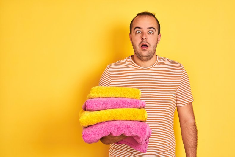 File photo of a man holding towels.