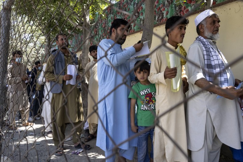 Afghans Wait in Line at Passport Office