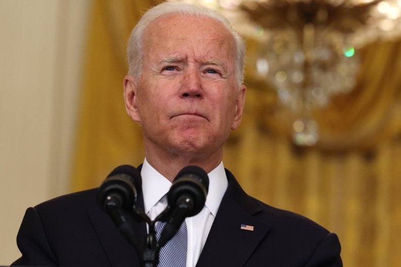 President Joe Biden pauses while giving remarks 