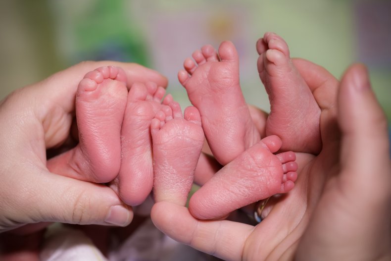 Three babies' feet 