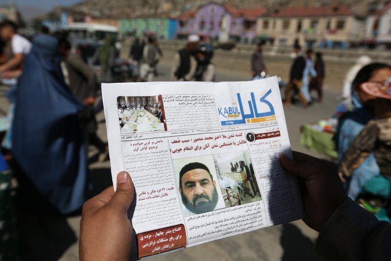 An Afghan Man Reads a Newspaper