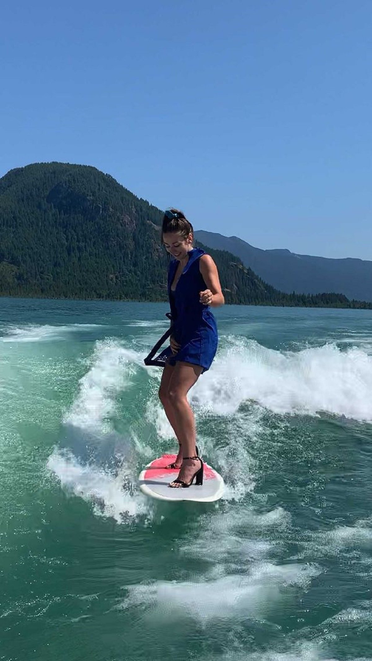 Cassandra Hildebrand surfing in heels.