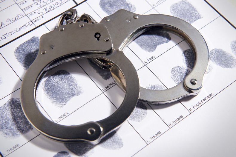 A stock photo of handcuffs and fingerprints