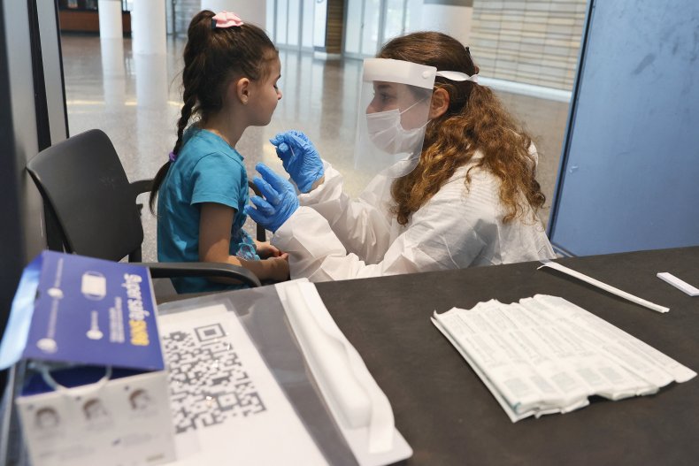 An Israeli child undergoes an antigen test