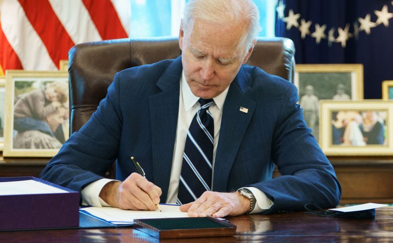 US President Joe Biden signs the American 