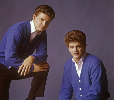 The Everly Brothers posing together.