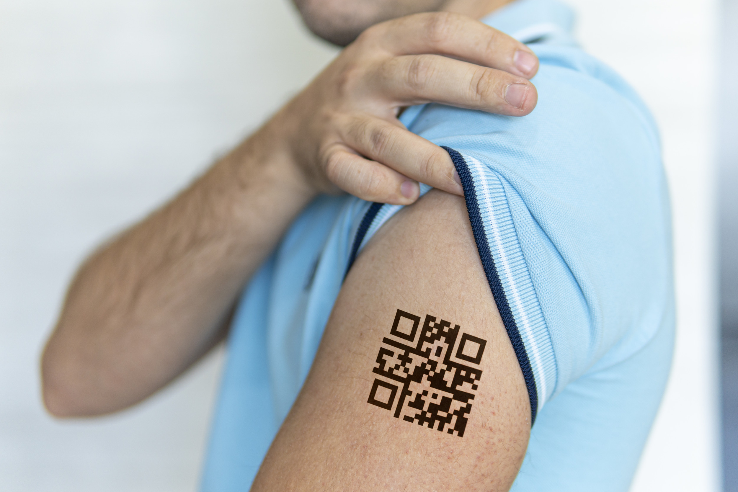 Barcode ID Number Tattoo On Wrist Of Dark Skinned Person And USA States  Flag On Background - Louisiana Stock Photo, Picture and Royalty Free Image.  Image 48067444.