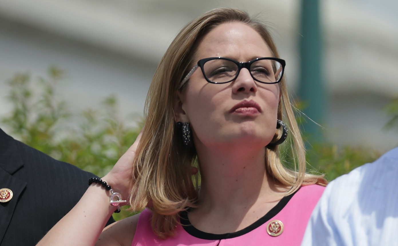 As Biden Reels From Afghan Debacle, Kyrsten Sinema Warns Of Defeat At ...