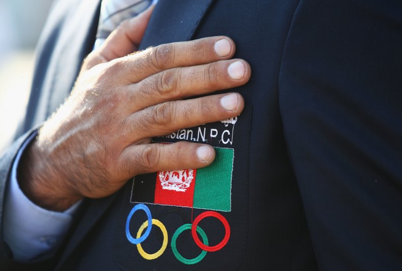 Afghanistan flag and Olympic logo on jacket.