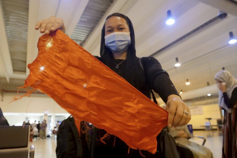 Amina shows red scarf