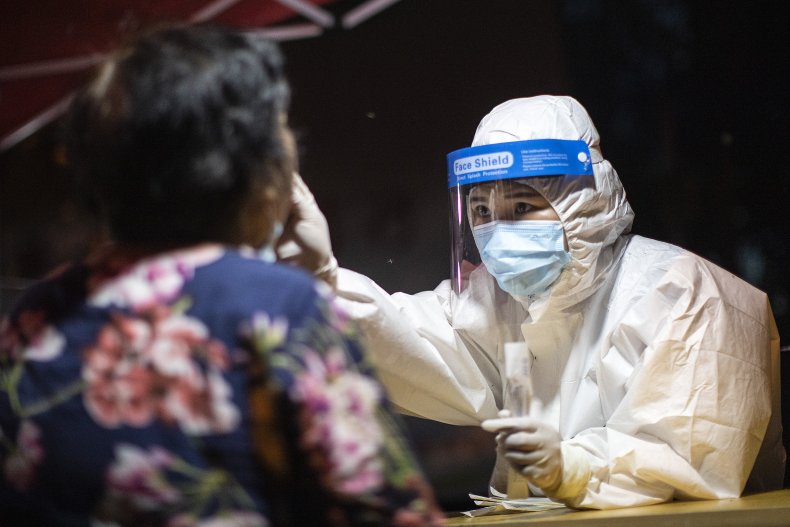 Wuhan Medical Worker Takes COVID Swab