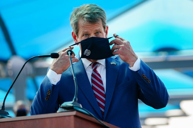 Georgia Gov. Brian Kemp Puts On Mask
