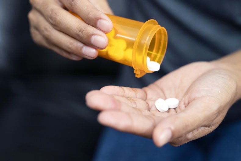 Stock image of a woman with pills