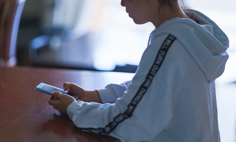 Teenager using a smartphone