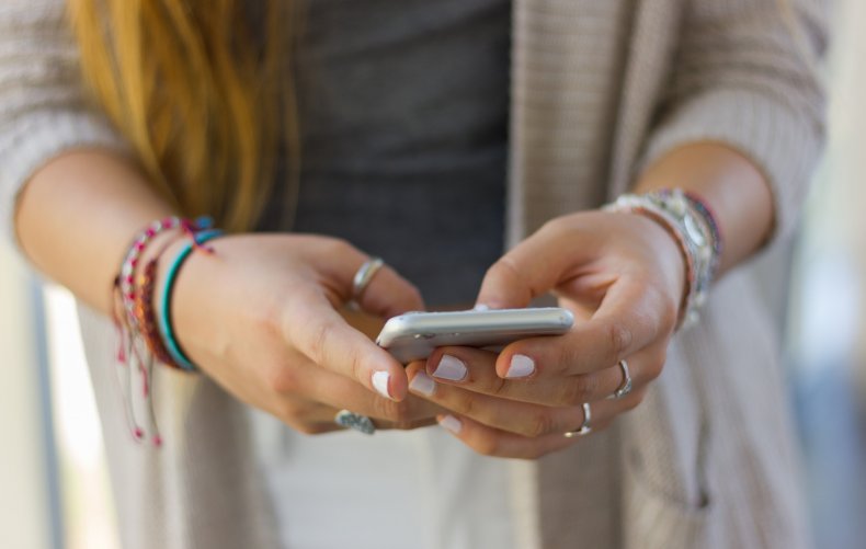 Teenager using a smartphone