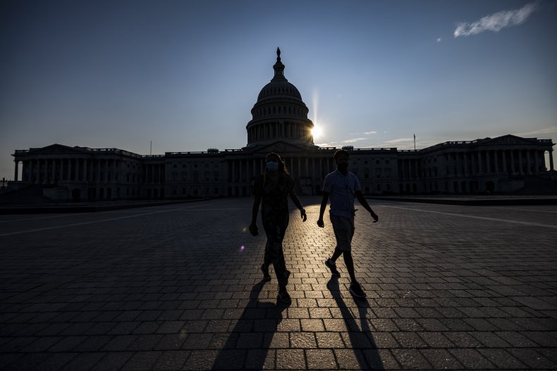 Couple Walks Past U.S. Capitol Building