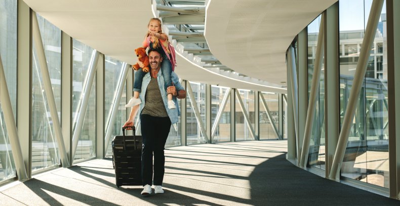 Father and daughter in an airport