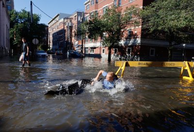 Man Falls in Flooded Street