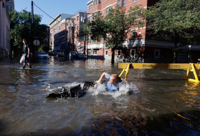 Man Falls in Flooded Street Man Falls in Flooded Street