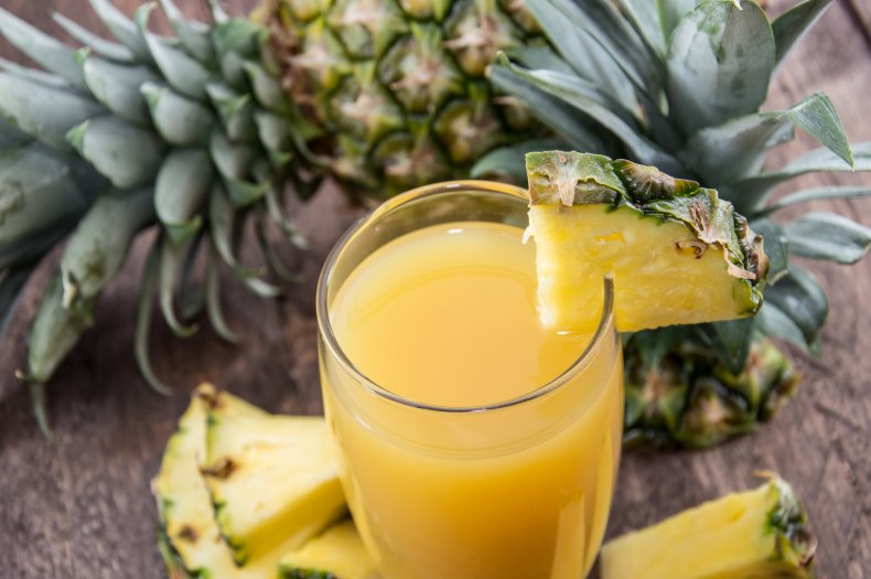 Glass of pineapple juice with fruit