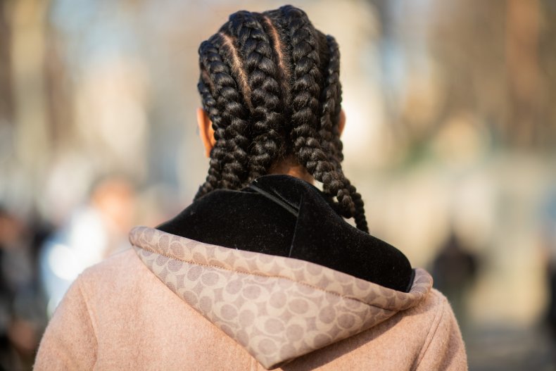 A model is seen with cornrows